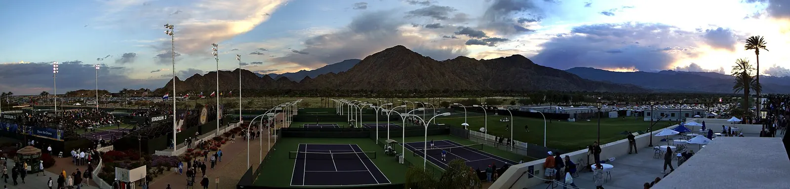 Indian Wells Tennis Garden grounds at sunset with the mountains behind
