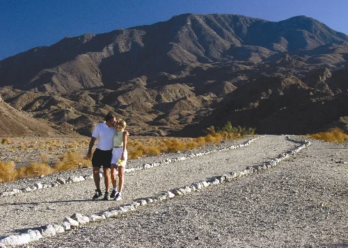 Hikers on a desert trail at Cove Oasis in La Quinta