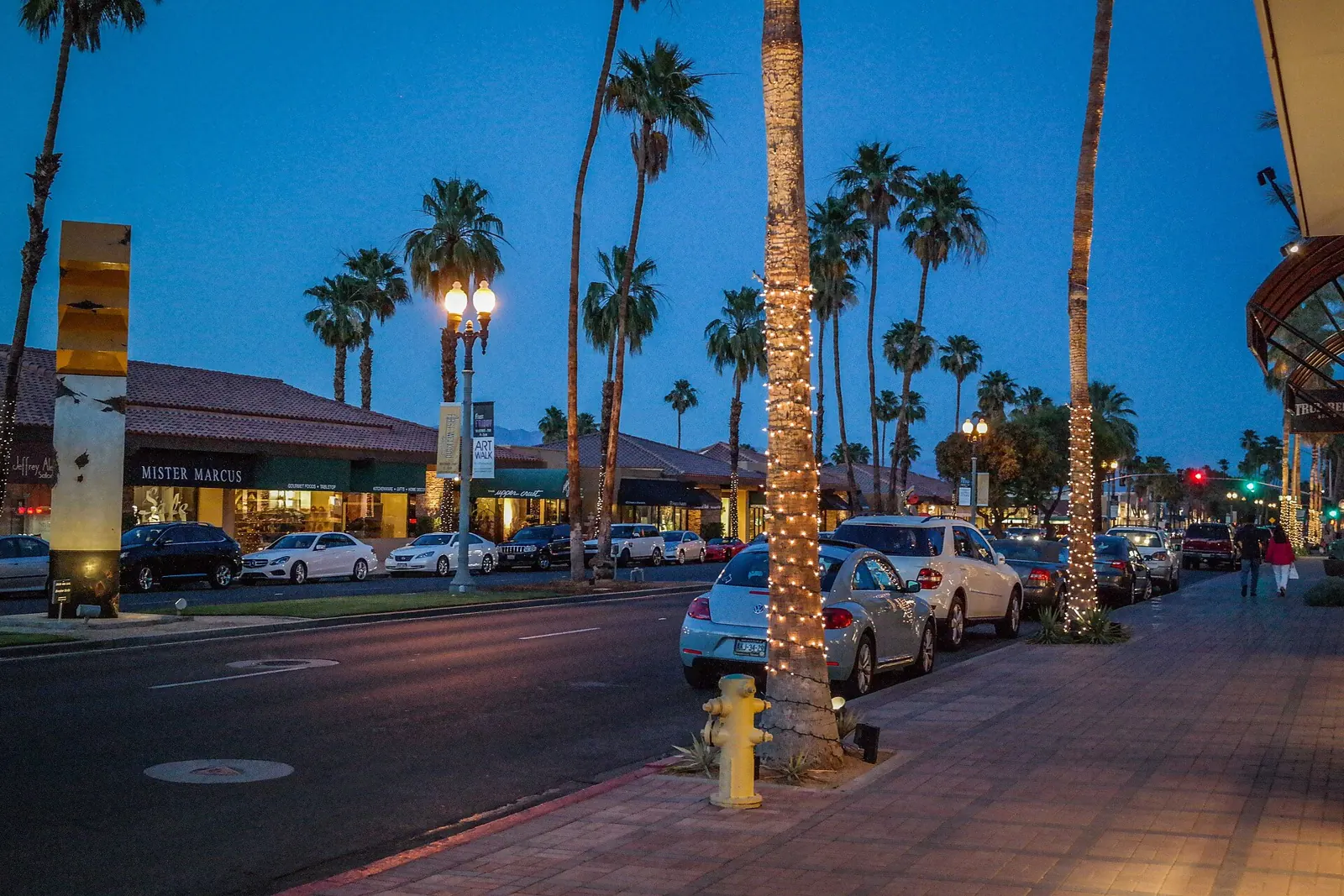 El Paseo storefronts and palms at dusk